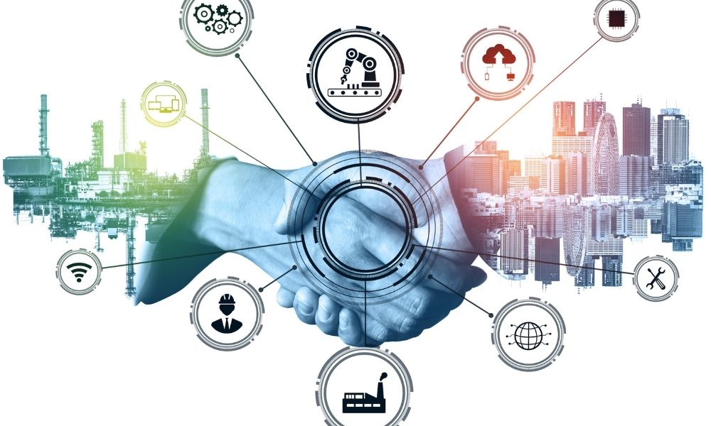 Business handshake overlaid with industrial, manufacturing, and digital technology icons representing collaboration, reliability, and operational excellence.